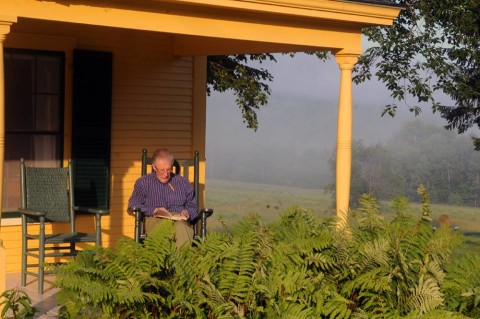 Michael Armstrong on the porch of Bridgman Cottage at the Bread Loaf School of English.